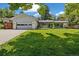 Charming single-story home featuring a well-manicured lawn, classic design, and a welcoming front entrance at 937 S Cole Dr, Lakewood, CO 80228