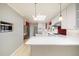 Bright kitchen features a large island, pendant lights, and stainless steel appliances at 937 S Cole Dr, Lakewood, CO 80228