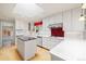 Bright kitchen featuring white cabinets, and stainless steel appliances at 937 S Cole Dr, Lakewood, CO 80228