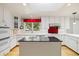 Kitchen island featuring granite countertop and white cabinets at 937 S Cole Dr, Lakewood, CO 80228