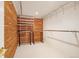 Walk-in closet with wood paneling and white shelving, and hanging rods at 937 S Cole Dr, Lakewood, CO 80228