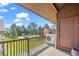 Balcony with a view of the well-maintained green space and surrounding residential buildings at 501 Manhattan Dr # 202, Boulder, CO 80303