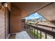 Balcony with mountain views, brick wall, and wood railing at 501 Manhattan Dr # 202, Boulder, CO 80303