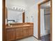 Bathroom with wood vanity and mirror with a walk in tub/shower at 501 Manhattan Dr # 202, Boulder, CO 80303