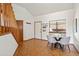 Dining area with parquet floors, modern light fixtures, and access to staircase at 501 Manhattan Dr # 202, Boulder, CO 80303