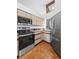 Modern kitchen with stainless steel appliances, stylish cabinets, and parquet flooring at 501 Manhattan Dr # 202, Boulder, CO 80303