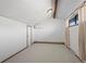 Well-lit living room with a large window, neutral carpet, and an air conditioning unit at 501 Manhattan Dr # 202, Boulder, CO 80303