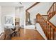 Open-concept living room and dining area with stunning stone fireplace and staircase access at 501 Manhattan Dr # 202, Boulder, CO 80303