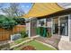 Enclosed backyard features artificial turf, decorative fire pit, patio and shade covering at 17108 E Whitaker Dr # B, Aurora, CO 80015