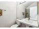 Bathroom features a sleek vanity, a well-lit mirror, and a tiled shower stall at 17108 E Whitaker Dr # B, Aurora, CO 80015