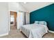 Bedroom with a striking accent wall, closet, ensuite access and well-lit carpeted floor at 17108 E Whitaker Dr # B, Aurora, CO 80015