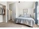 Cozy bedroom features vaulted ceiling, a comfortable bed, and easy access to closet and ensuite bathroom at 17108 E Whitaker Dr # B, Aurora, CO 80015