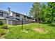 Beautiful backyard featuring a manicured lawn, mature trees, and a privacy fence, offering a serene outdoor retreat at 5821 E Ithaca Pl, Denver, CO 80237