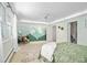 Light filled bedroom with comfortable work space, king bed, and mountain mural at 5821 E Ithaca Pl, Denver, CO 80237