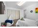 Cozy bedroom with wood floors, ample closet space and fun decorations at 5821 E Ithaca Pl, Denver, CO 80237