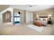 Bedroom with a plush bed, a full-length mirror, and an attached walk-in closet at 5821 E Ithaca Pl, Denver, CO 80237