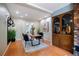 Dining area with hardwood floors, neutral walls, and modern lighting at 5821 E Ithaca Pl, Denver, CO 80237