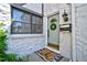 Inviting front entrance with a charming door, decorative wreath, and stylish welcome mat at 5821 E Ithaca Pl, Denver, CO 80237