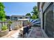 Charming outdoor patio with stylish seating and colorful artistic fence, perfect for relaxing or entertaining guests at 5821 E Ithaca Pl, Denver, CO 80237