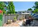 Cozy outdoor space with stylish patio seating, mature landscaping, and an artistic fence creating a tranquil retreat at 5821 E Ithaca Pl, Denver, CO 80237