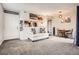 Stylish living room with open layout, connecting to a dining area and modern kitchen at 1005 S Miller St # 102, Lakewood, CO 80226