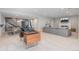 Finished basement with fireplace, TV, ping pong table, office and seating area at 11916 S Meander Way, Parker, CO 80138
