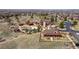 Aerial view of the community pool, recreation center, and outdoor areas, surrounded by homes and trees at 11916 S Meander Way, Parker, CO 80138