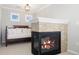 Inviting sitting area off the main bedroom features a fireplace and relaxing furniture at 11916 S Meander Way, Parker, CO 80138