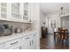 Cozy kitchen area with quartz counters, white cabinetry, and breakfast nook at 11916 S Meander Way, Parker, CO 80138