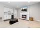 Modern living room with a cozy fireplace, TV, and mini bar for entertaining at 11916 S Meander Way, Parker, CO 80138
