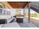 Covered patio area including outdoor furniture and a hammock at 11916 S Meander Way, Parker, CO 80138
