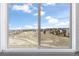 Scenic window view of a neighborhood and surrounding landscape at 11916 S Meander Way, Parker, CO 80138