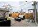 Outdoor patio with comfortable seating and a well-maintained fenced yard perfect for relaxing or entertaining at 4425 Quitman St, Denver, CO 80212