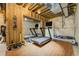 Basement workout area with treadmill, mirrors, and wood-look flooring ready for your active lifestyle at 4425 Quitman St, Denver, CO 80212