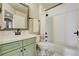 Bathroom features a dark bronze faucet with a green vanity at 4425 Quitman St, Denver, CO 80212