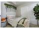 Bedroom with single bed and floral wall decor at 4425 Quitman St, Denver, CO 80212