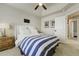 Bright bedroom with a striped duvet on a bed at 4425 Quitman St, Denver, CO 80212