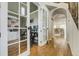 Home office features glass French doors and built-in bookshelves for organization and natural light at 4425 Quitman St, Denver, CO 80212