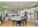 Open-concept kitchen and dining area with hardwood floors and stainless steel appliances at 4425 Quitman St, Denver, CO 80212