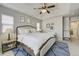 Calm main bedroom with ceiling fan, natural light, and neutral tones at 4425 Quitman St, Denver, CO 80212