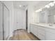 New bathroom with double vanity and glass shower at 1321 Rock Cliff Ave, Erie, CO 80516