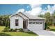 Charming single-Gathering home featuring a two-car garage, well-maintained lawn, and a welcoming entrance at 1321 Rock Cliff Ave, Erie, CO 80516