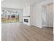 Beautiful living room with fireplace, hardwood floors, and view to the backyard at 1321 Rock Cliff Ave, Erie, CO 80516