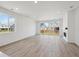 Spacious living room with a fireplace, big windows, and hardwood floors at 1321 Rock Cliff Ave, Erie, CO 80516