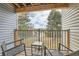 Cozy balcony with seating provides views of the street and trees at 7835 Barbara Ann Dr # F, Arvada, CO 80004