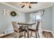 Charming dining area with a table set for four, complemented by stylish decor and natural light at 7835 Barbara Ann Dr # F, Arvada, CO 80004