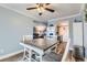 Bright dining area with a table for four, open to both the living room and the kitchen at 7835 Barbara Ann Dr # F, Arvada, CO 80004