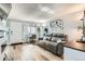Inviting living room showcasing a comfortable couch, a desk area, and ample natural light at 7835 Barbara Ann Dr # F, Arvada, CO 80004