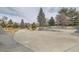 A large, empty skatepark in a community with skate ramps at 7835 Barbara Ann Dr # F, Arvada, CO 80004
