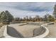 An empty skatepark features concrete ramps, bowls, and various obstacles at 7835 Barbara Ann Dr # F, Arvada, CO 80004